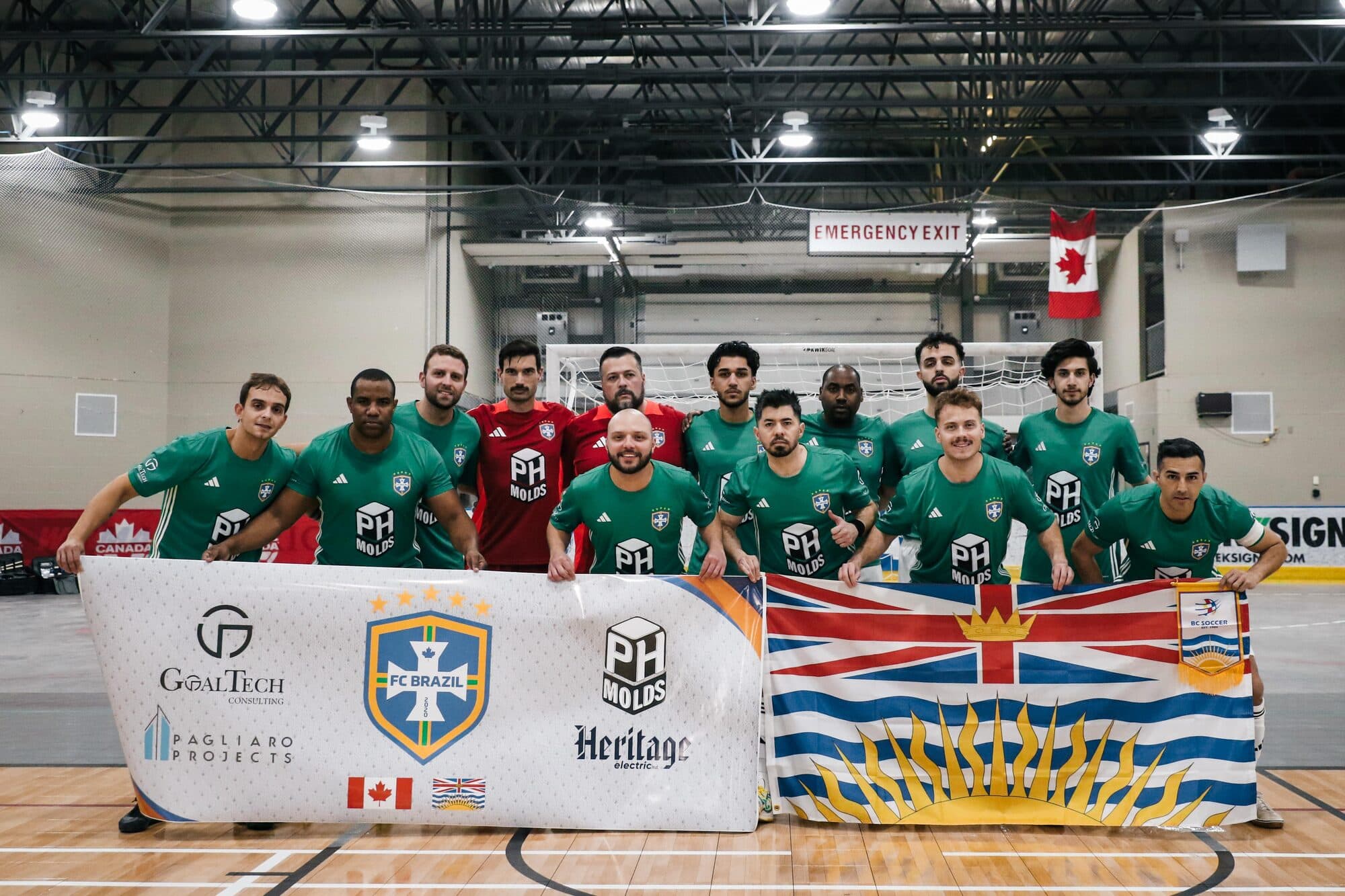 Coach Yusif Mudaffer with his team, holding the BC flag after representing British Columbia at the Canadian Futsal National Championships